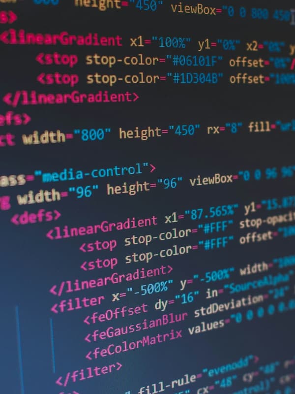 Close-up of colourful HTML and SVG code on a screen